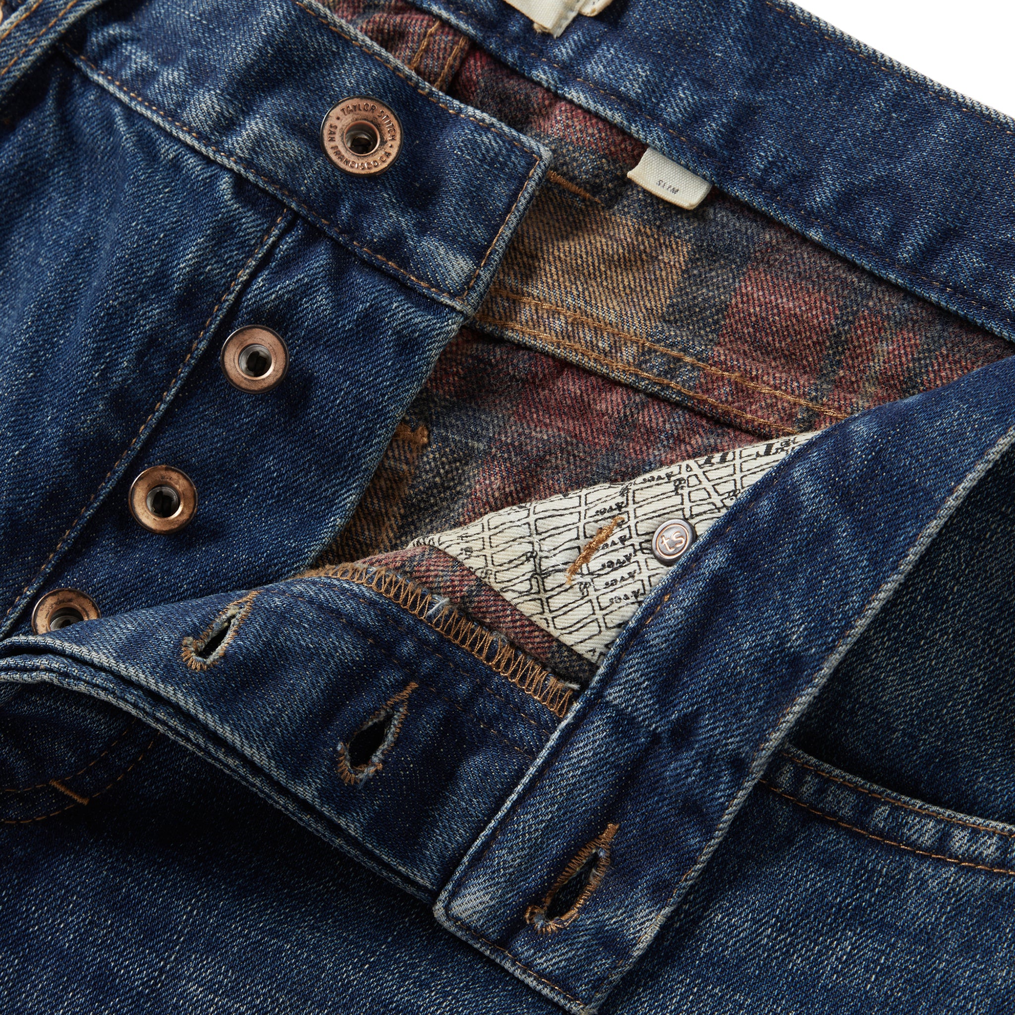 material shot of the button fly on The Slim Brushed Back Jean in Sawyer Wash Organic Selvage, Bottoms by Taylor Stitch