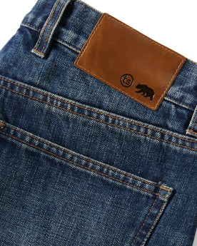 material shot of the leather logo panel on The Slim Brushed Back Jean in Sawyer Wash Organic Selvage, Bottoms by Taylor Stitch