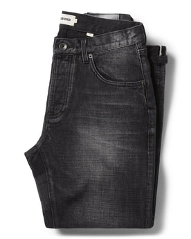 flatlay of The Slim Jean in Black 3-Month Wash Selvage folded, Bottoms by Taylor Stitch