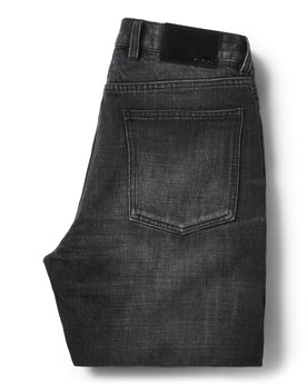 flatlay of the back of The Slim Jean in Black 3-Month Wash Selvage folded, Bottoms by Taylor Stitch