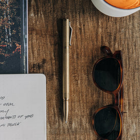 material shot of The Pen in Brass on a wooden table