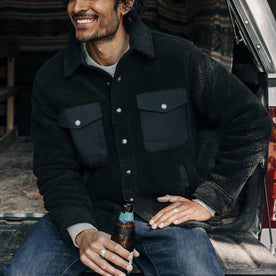 fit model posing in The Timberline Jacket in Onyx Sherpa