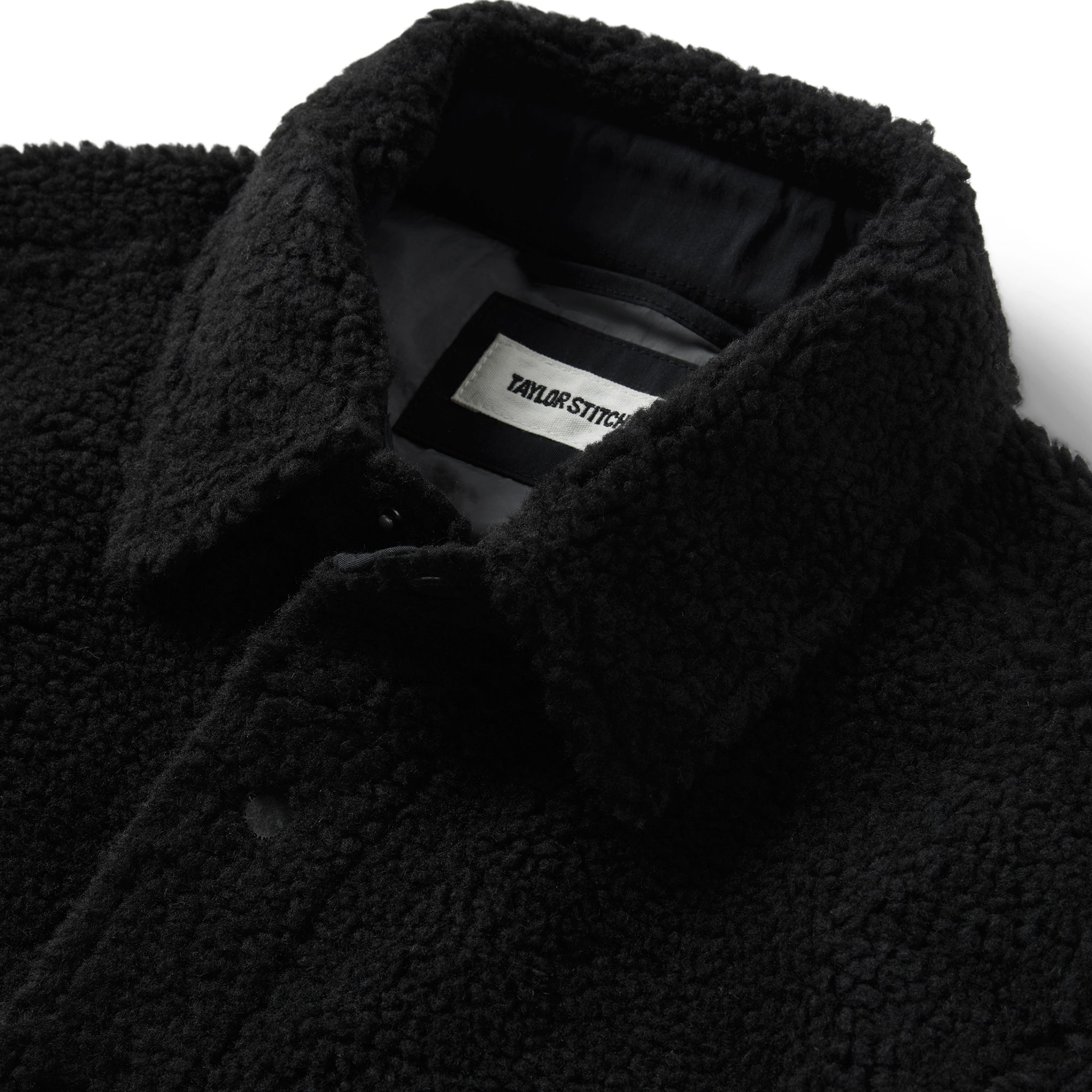 material shot of the collar on The Timberline Jacket in Onyx Sherpa, Outerwear by Taylor Stitch