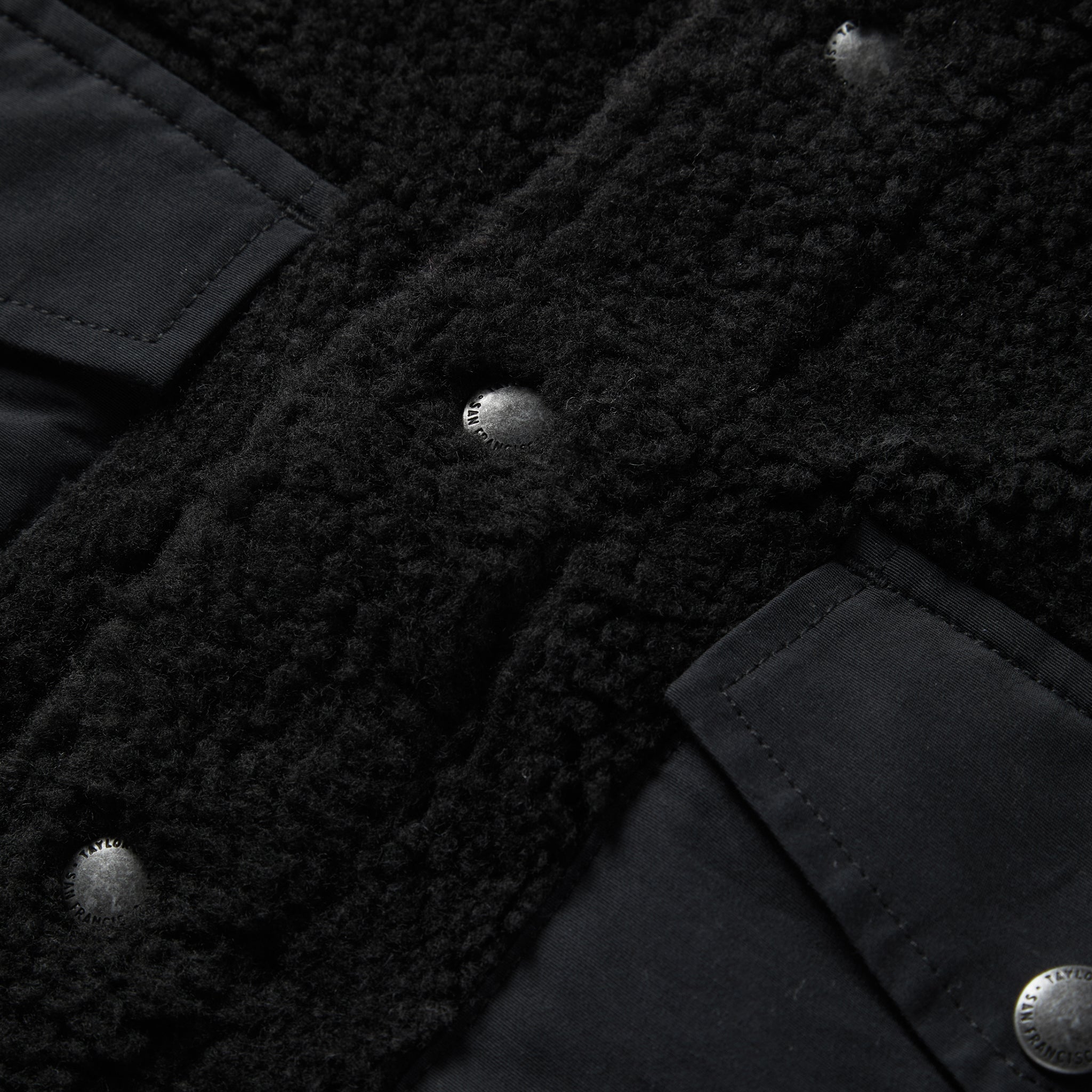 material shot of the buttons on The Timberline Jacket in Onyx Sherpa, Outerwear by Taylor Stitch