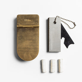 editorial image of The Tinder Box in Brass shown next to other products