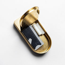editorial image of The Tinder Box in Brass opened with products inside