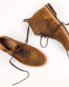 material shot of The Trench Boot in Golden Brown Waxed Suede top and side, Footwear by Taylor Stitch