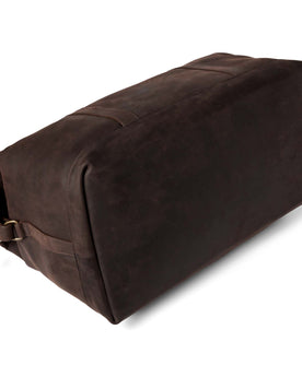 flatlay of The Weekender Duffle Bag in Espresso, shown on its side, Accessories by Taylor Stitch