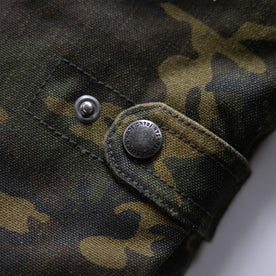 material shot of the cinch clasp on The Workhorse Vest in Camo Boss Duck