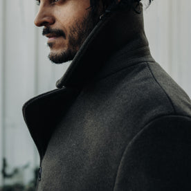 fit model showing the side of The Mariner Coat in Army Melton Wool
