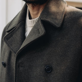 fit model showing the collar of The Mariner Coat in Army Melton Wool