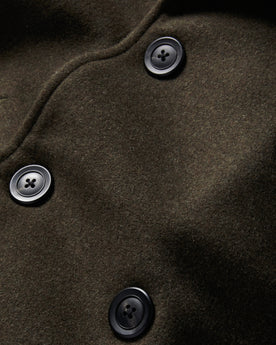 material shot of the buttons on The Mariner Coat in Army Melton Wool, Outerwear by Taylor Stitch