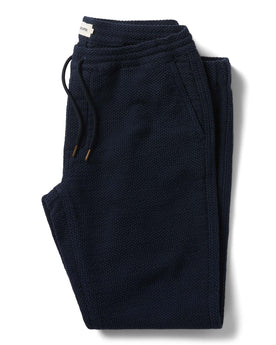 flatlay of The Apres Pant in Navy Sashiko folded, Bottoms by Taylor Stitch