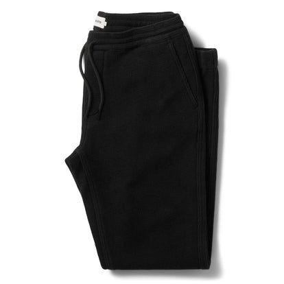 flatlay of The Apres Pant in Coal Waffle folded