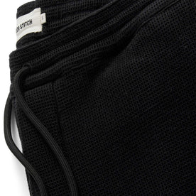 material shot of the drawstrings on The Apres Pant in Coal Waffle