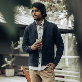 fit model with his hand in his pocket wearing The Weekend Cardigan in Charcoal Herringbone Wool