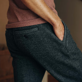 fit model with his hand in his pocket of The Weekend Pant in Charcoal Herringbone Wool 