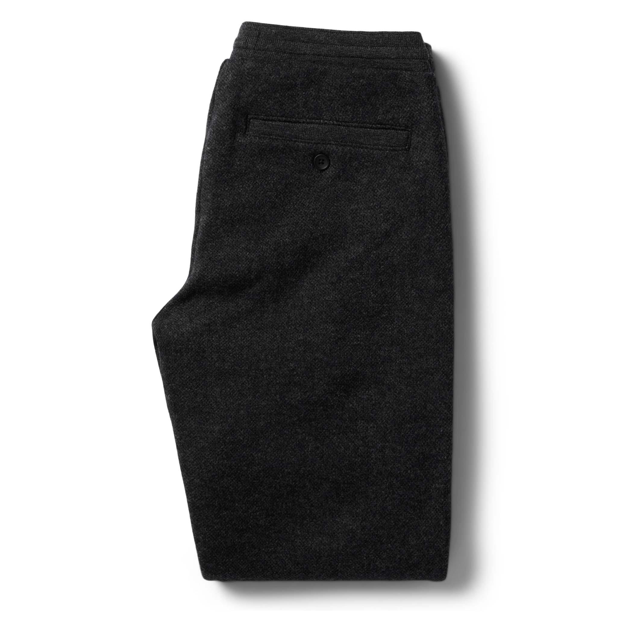 flatlay of the back of The Weekend Pant in Charcoal Herringbone Wool folded, Bottoms by Taylor Stitch