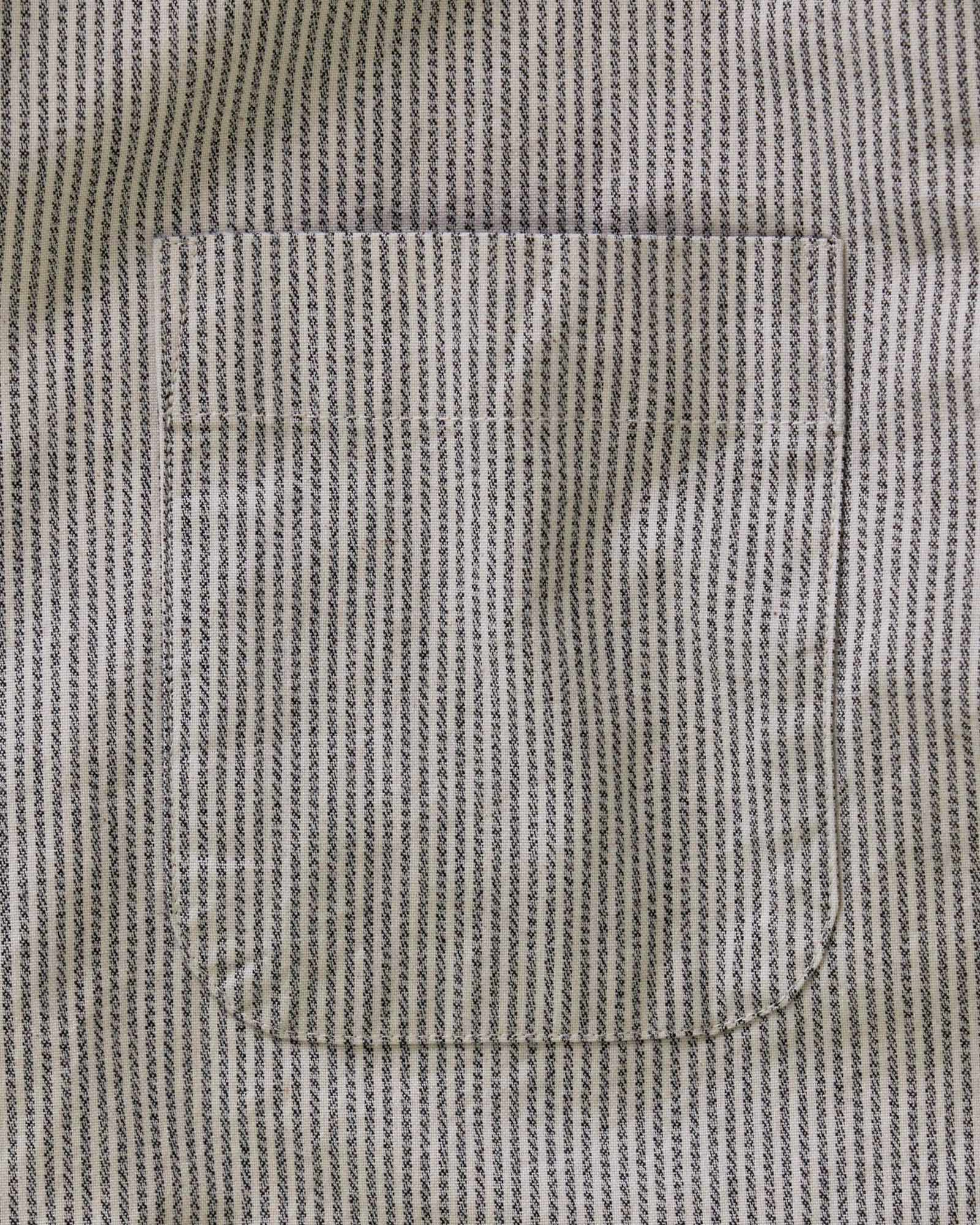 material shot of the button on the back collar of The Jack in Coal Jaspe University Stripe Oxford, Wovens by Taylor Stitch