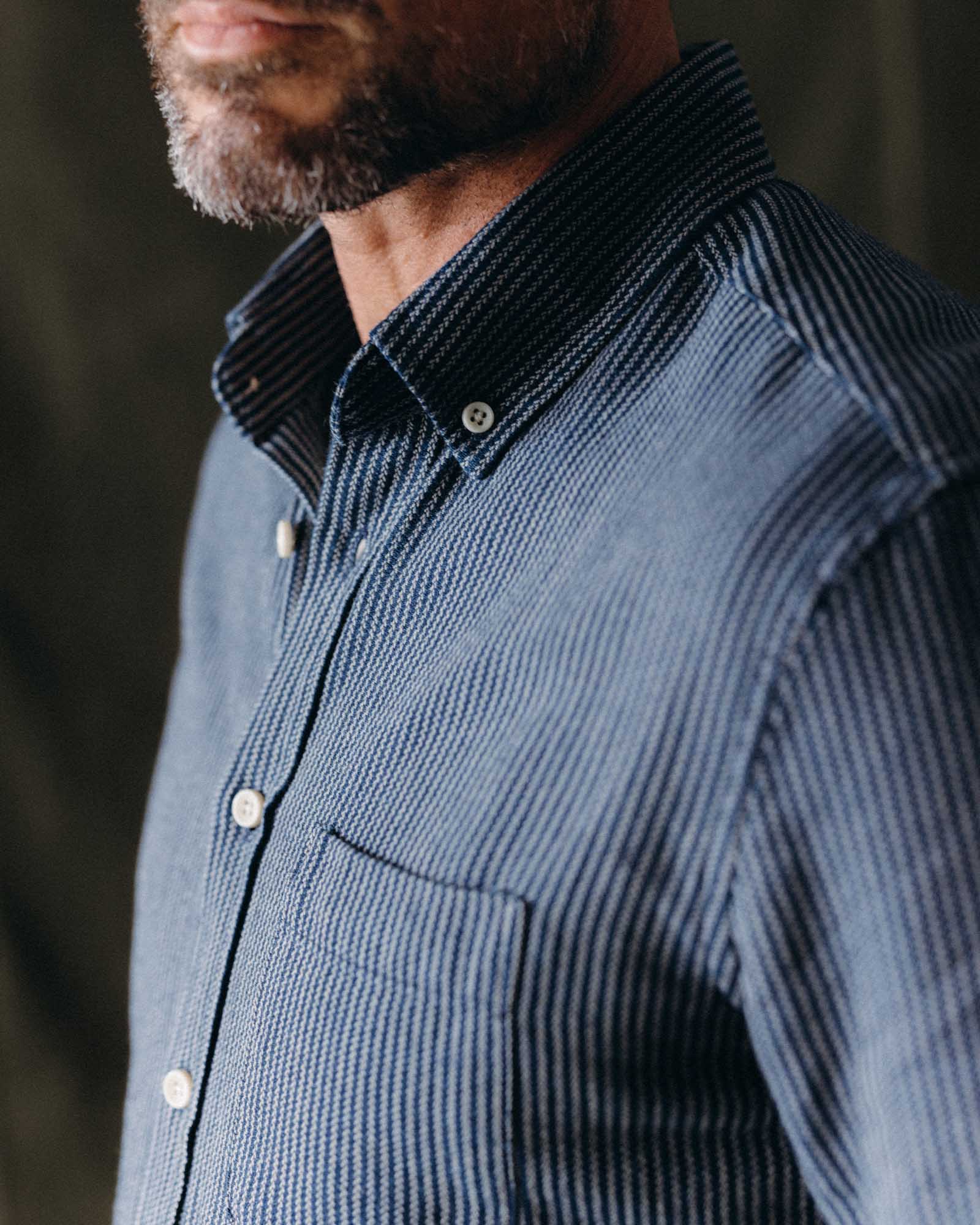 fit model adjusting the sleeves of The Jack in Roped Indigo, Wovens by Taylor Stitch