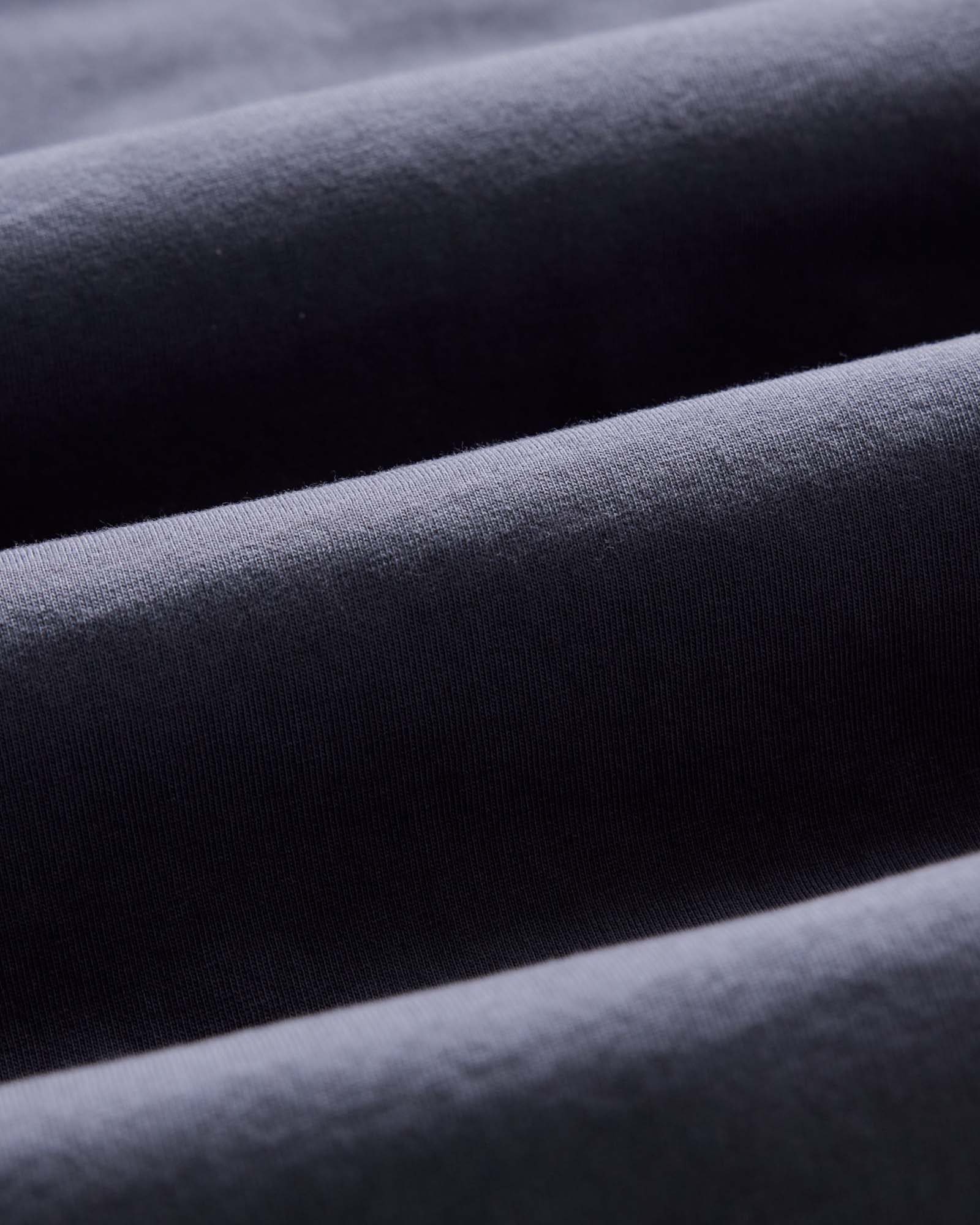 material shot of the sleeve on The Organic Cotton Tee in Navy, Knits by Taylor Stitch