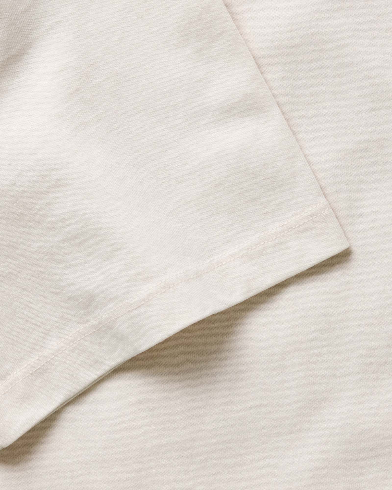 material shot of the neck opening on The Organic Cotton Tee in Vintage White, Knits by Taylor Stitch
