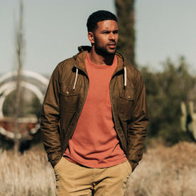 our fit model wearing The Welterweight Winslow in Field Tan Waxed Canvas out in the desert—cropped shot looking left