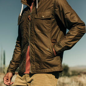 our fit model wearing The Welterweight Winslow in Field Tan Waxed Canvas out in the desert—cropped shot of chest