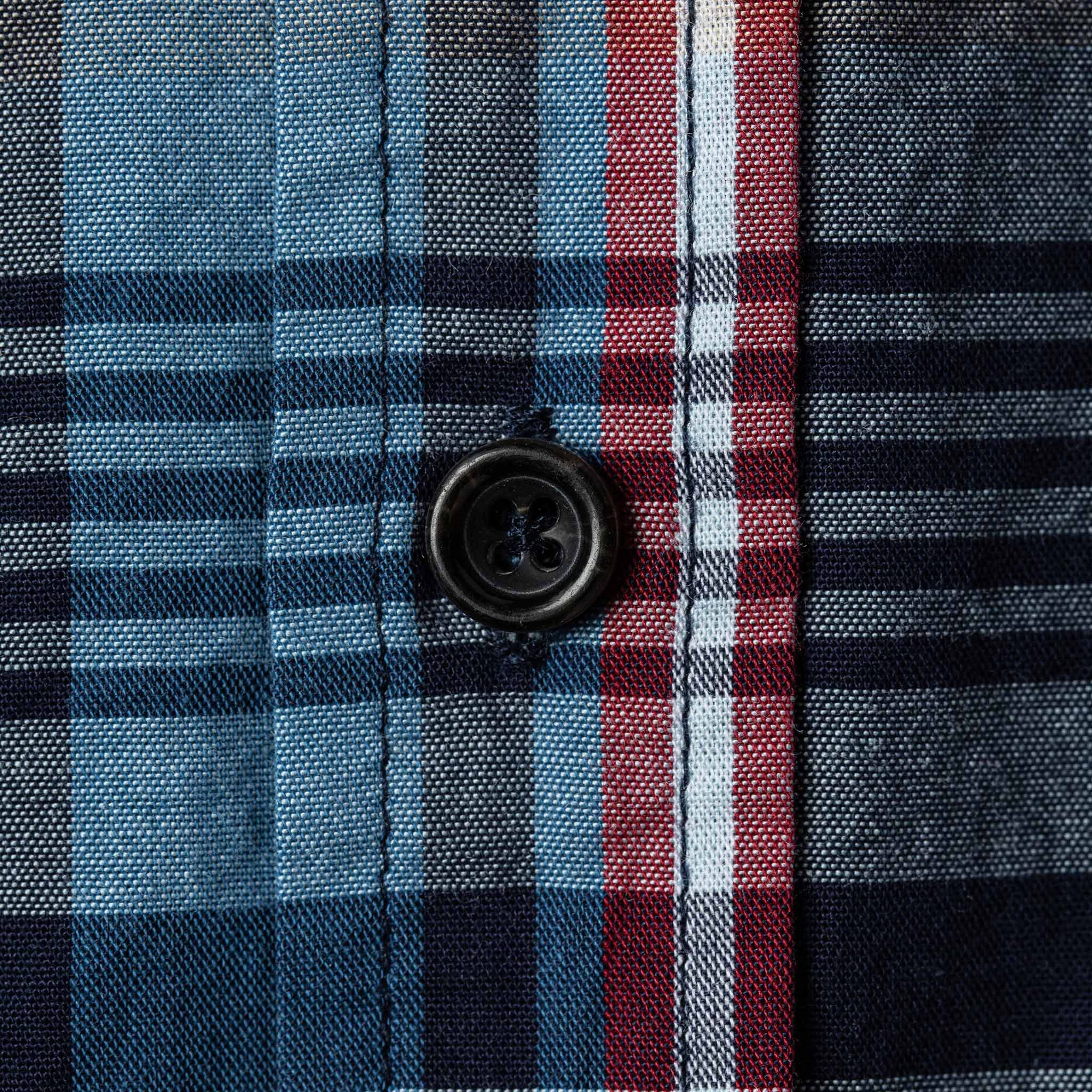 Close up material shot of button and perpendicular plaid, Wovens by Taylor Stitch