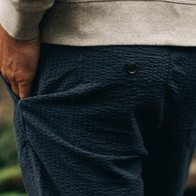 our fit model wearing The Après Pant in Navy Seersucker—cropped shot of pant back