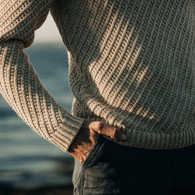 fit model wearing The Adirondack Sweater in Natural, hand in pocket, cropped