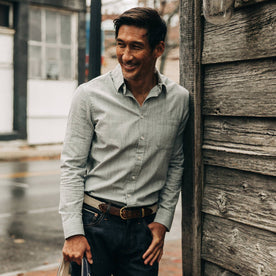 fit model wearing The California in Midnight Slub Micro Stripe, leaning against wall