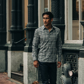 fit model wearing The California in Navy Salt and Pepper Plaid, walking on sidewalk