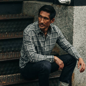 fit model wearing The California in Navy Salt and Pepper Plaid, sitting on stairs
