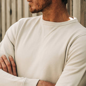 fit model wearing The Crewneck in Aluminum Terry, arms crossed, cropped shot