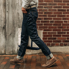 fit model wearing The Democratic Jean in Organic Selvage, walking down street