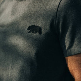 fit model wearingThe Embroidered Heavy Bag Tee in Grey Bear, chest detail