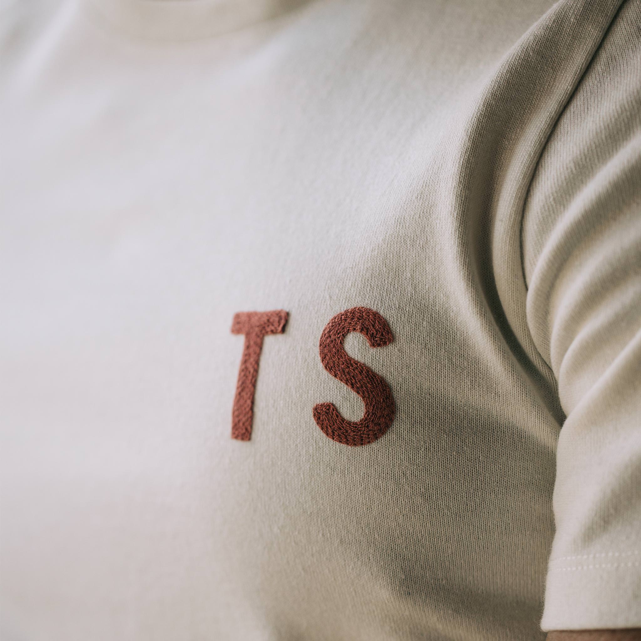 The Embroidered Heavy Bag Tee in Natural TS, chest detail, Knits by Taylor Stitch