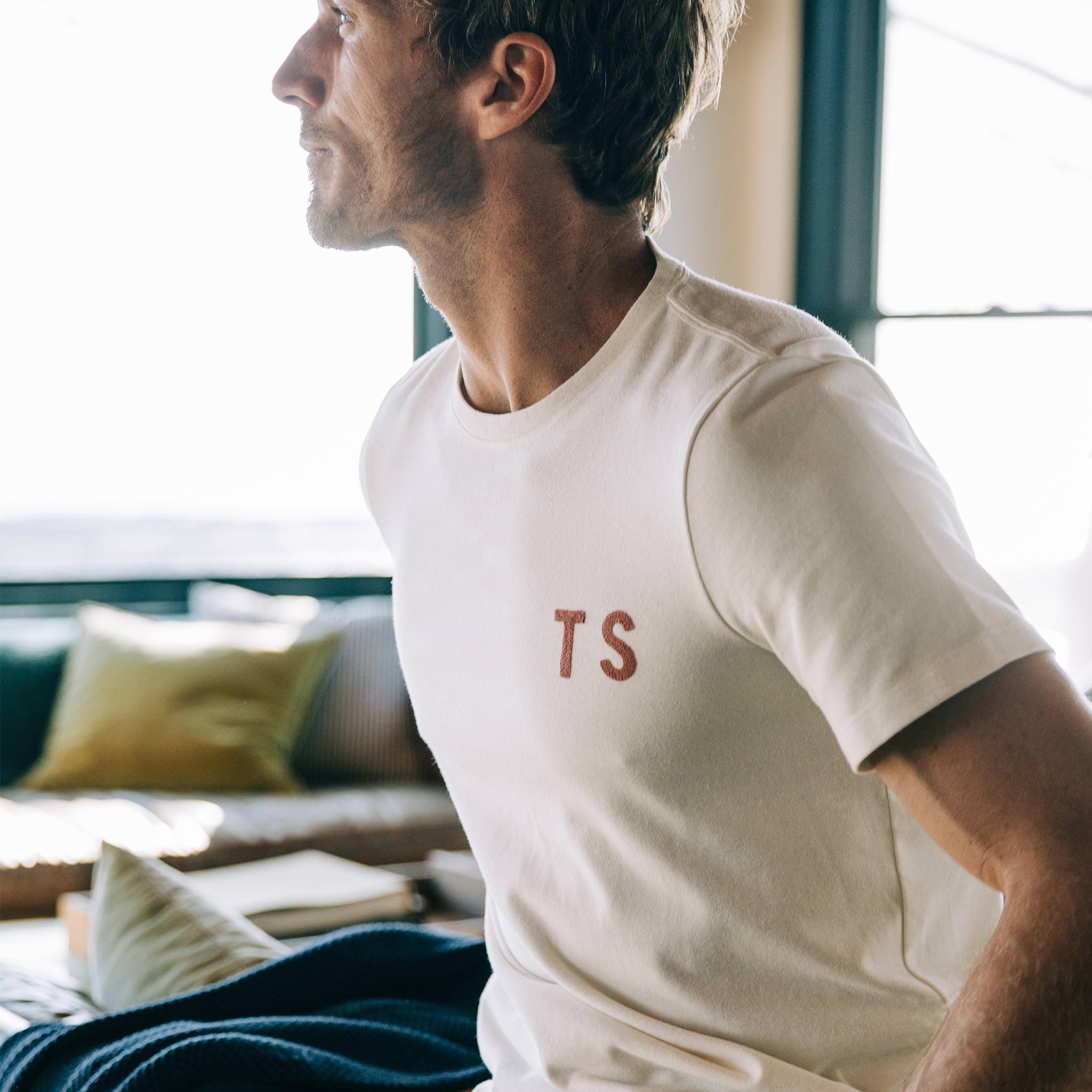 The Embroidered Heavy Bag Tee in Natural TS, looking left, Knits by Taylor Stitch