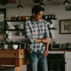 fit model wearing The Jack in Melange Navy Plaid, playing with sleeves, in kitchen