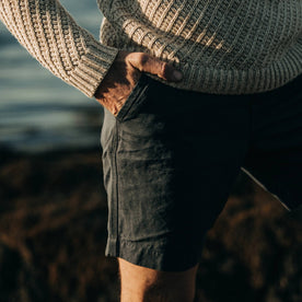 fit model wearing The Morse Short in Navy Slub Linen, hand in pocket, close up
