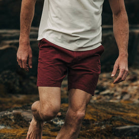 fit model wearing The Morse Short in Brick Red Slub Linen, cropped chest down