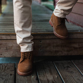 fit model wearing The Trench Boot in Butterscotch Weatherproof Suede, walking down stairs, Footwear by Taylor Stitch
