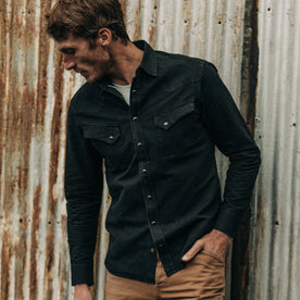 fit model wearing The Western Shirt in Washed Black Selvage Chambray, hand in pocket