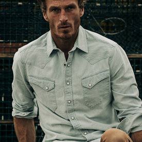 fit model wearing The Western Shirt in Washed Selvage Chambray, cropped shot forehead down