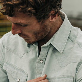 fit model wearing The Western Shirt in Washed Selvage Chambray, cropped chest up