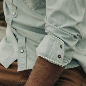fit model wearing The Western Shirt in Washed Selvage Chambray, cuffed sleeve detail