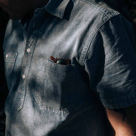 our fit model wearing The Short Sleeve Popover in Blue Chambray—cropped shot of sleeve and pocket
