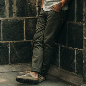 fit model wearing The Democratic All Day Pant in Olive Bedford Cord, hands in pockets