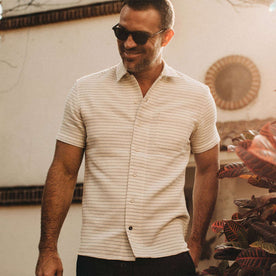 fit model wearingThe Short Sleeve Hawthorne in Natural Pickstitch Waffle, hand in pocket